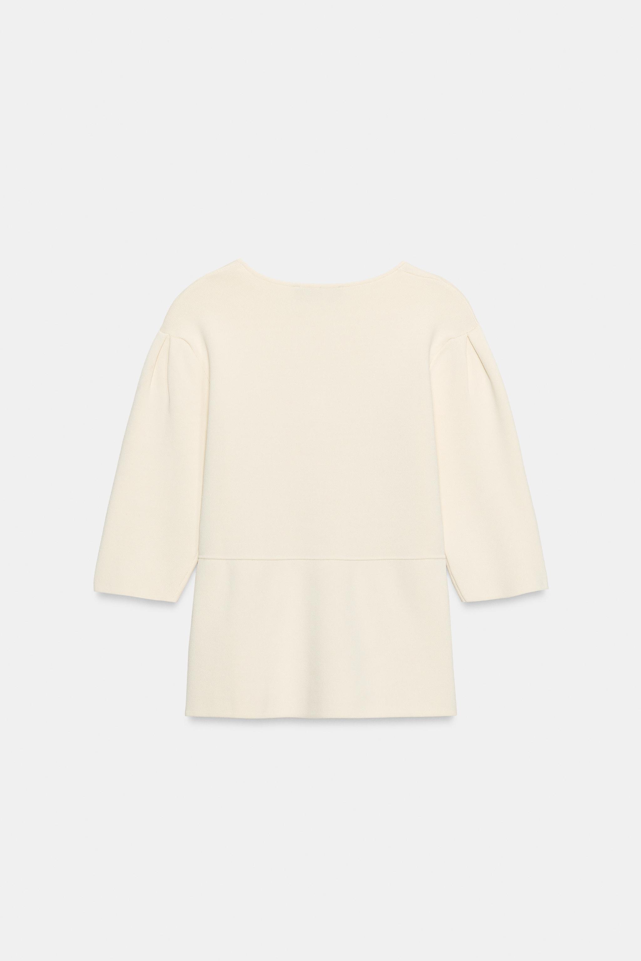GILET EN MAILLE À MANCHES COURTES